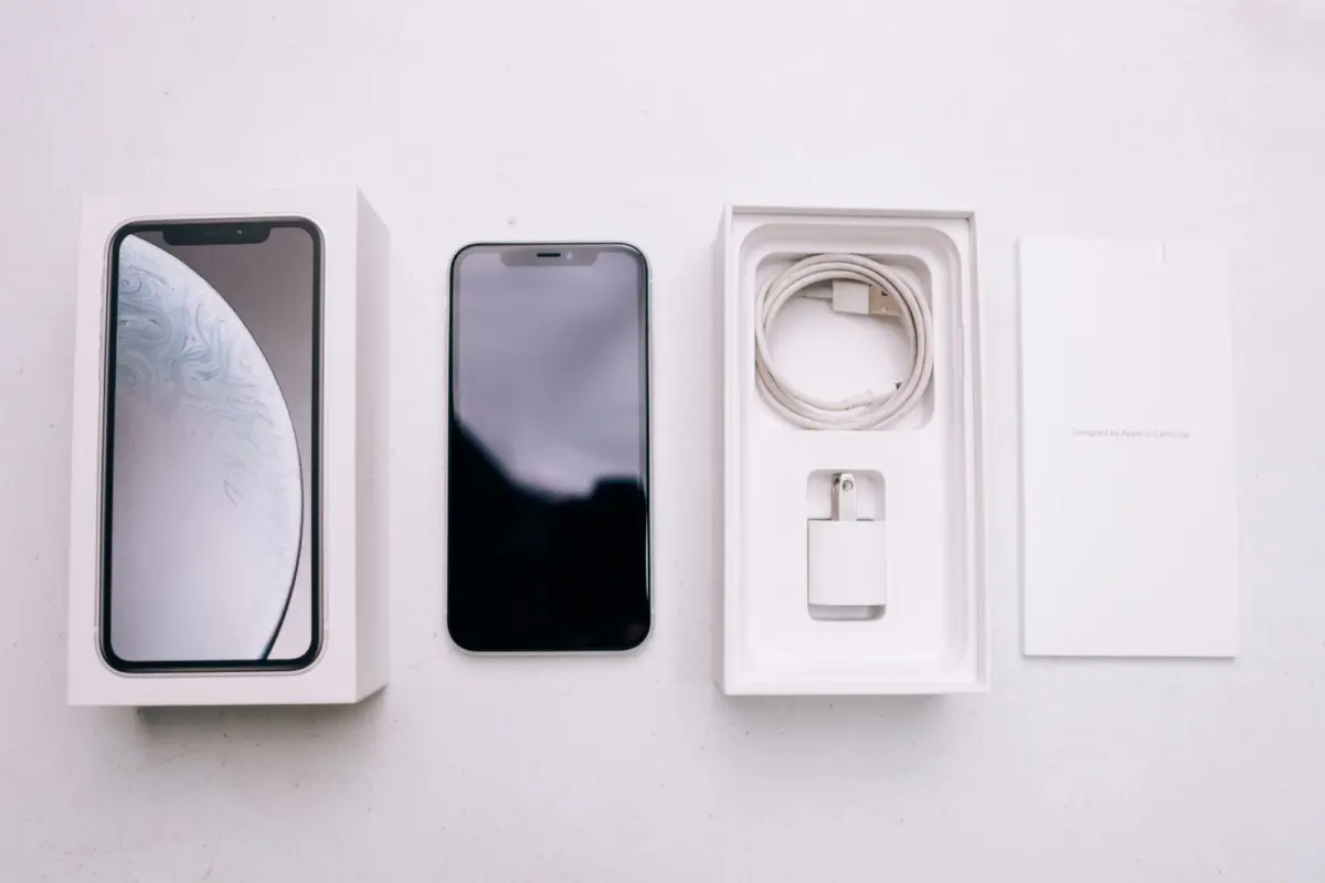 A new smartphone with its box and accessories